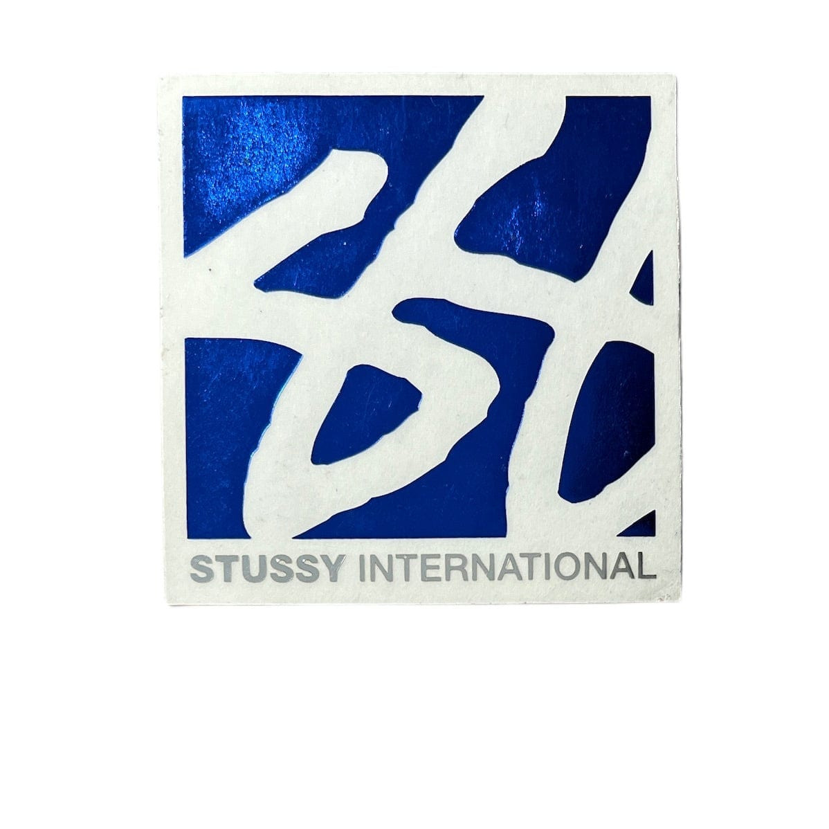 Stussy International Square Foil Sticker in blue. The sticker measures 2.75"x2.75".