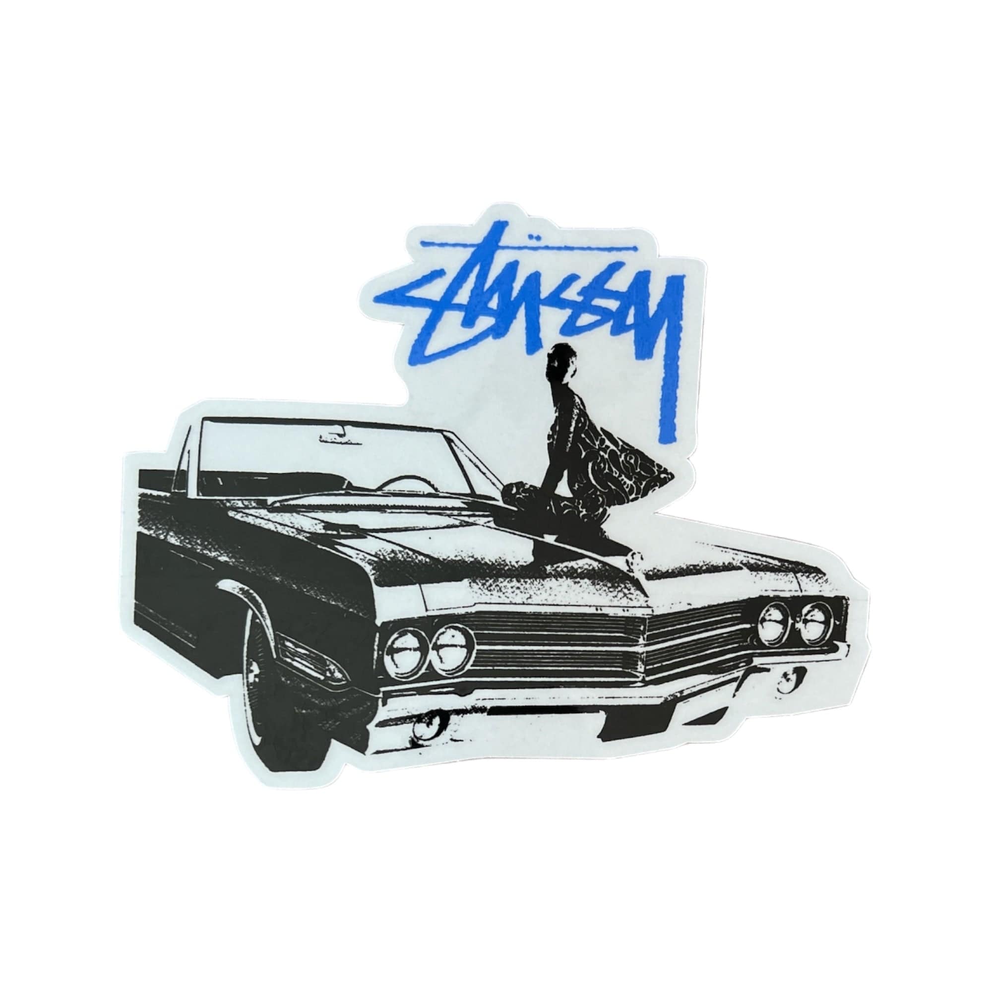 The image shows a sticker featuring a stylized black and white illustration of a classic convertible car with a person sitting on the hood, overlaid with the Stüssy logo in blue.