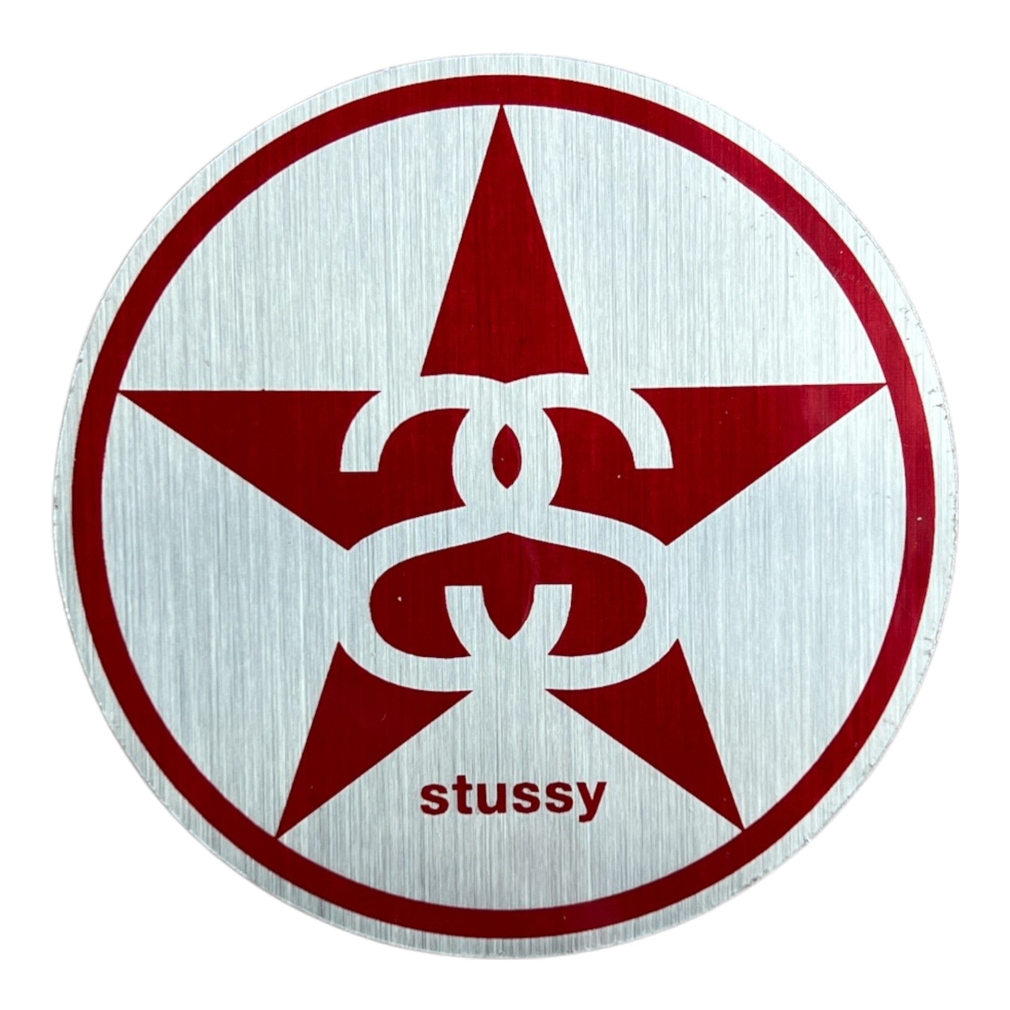stussy sticker with a red star on a foil background