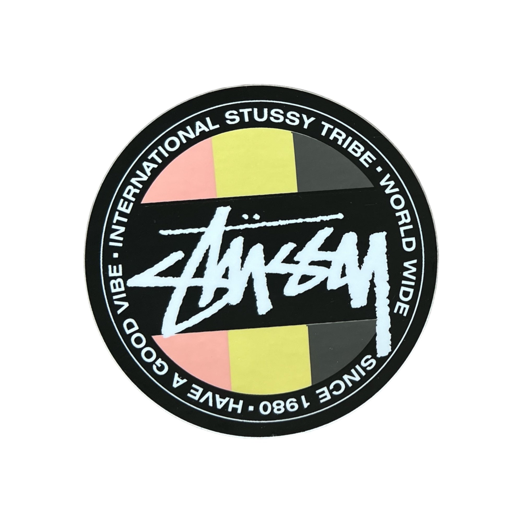 Stussy Tribe Worldwide Sticker in rasta colors. The sticker measures 3"x3".