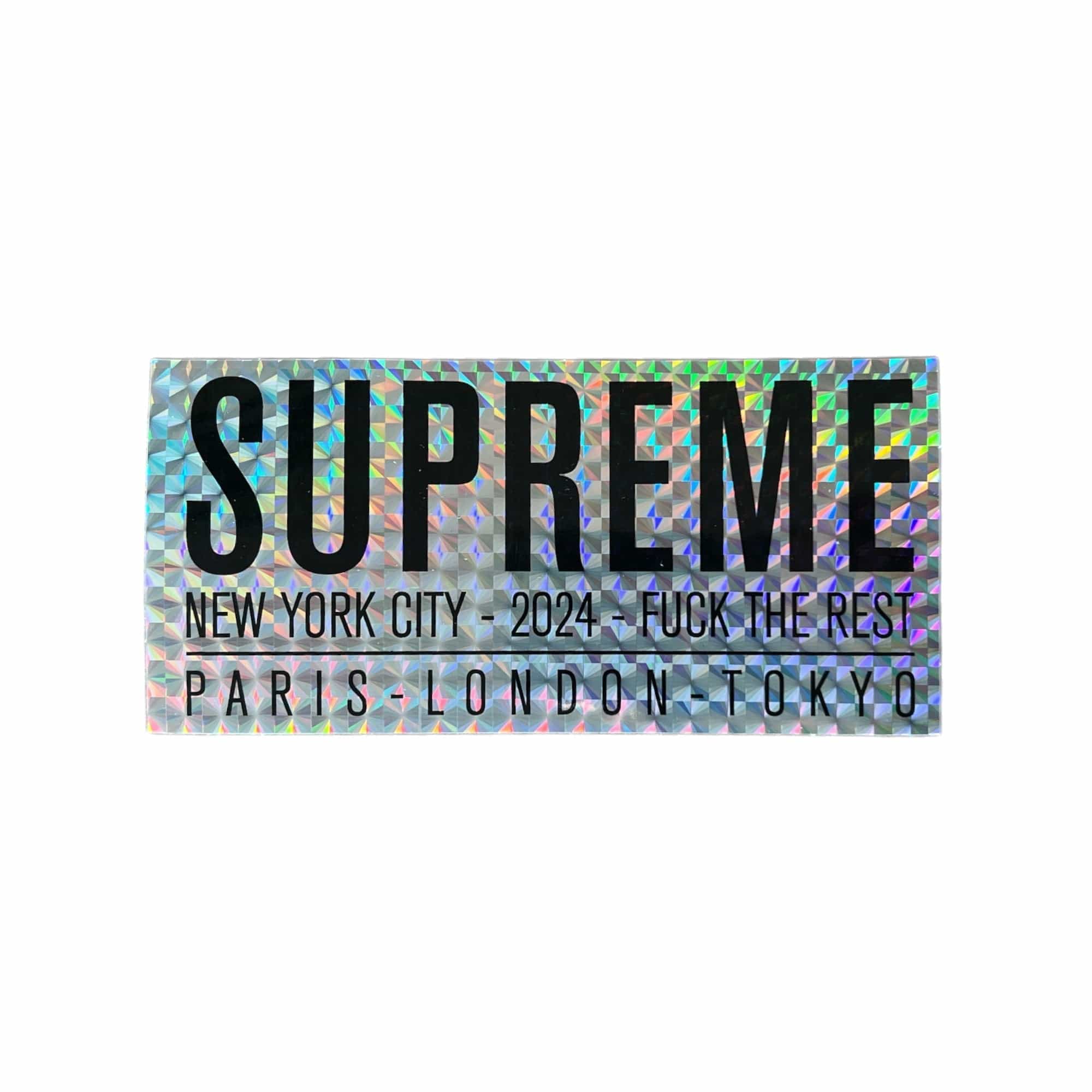 Supreme Paris Sticker in holographic silver released during the Spring Summer of 2024. The sticker measures 5.5"x2.5".